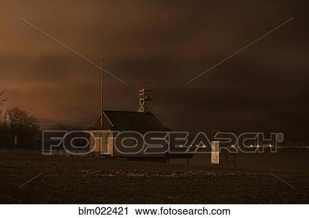 Stock Image - Cherry Beach Guard station at night during winter. Fotosearch