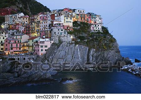 Stock Photo - Cinque Terre Town of Manarola at Dusk. Fotosearch