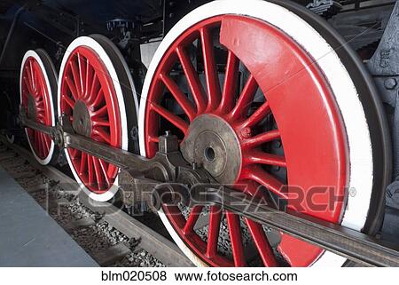 Close up of the rows of steel wheels of a locomotive train View Large Photo Image Stock Photo - Close up of the rows of steel wheels of a locomotive train. Fotosearch