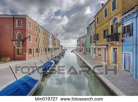 Stock Photo - Colorful Buildings and Boats Lining a Canal. Fotosearch