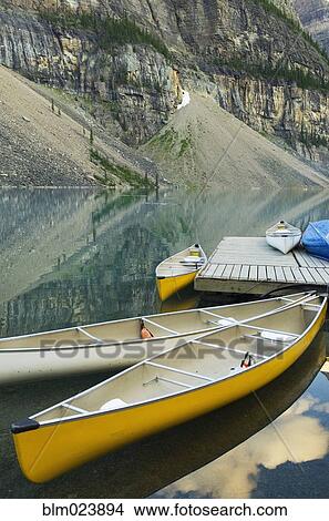 Colorful canoes on dock of Moraine Lake View Large Photo Image Picture - Colorful canoes on dock of Moraine Lake. Fotosearch