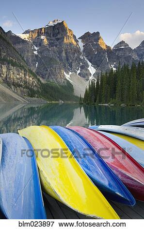 Colorful canoes on dock of Moraine Lake View Large Photo Image Stock Photo - Colorful canoes on dock of Moraine Lake. Fotosearch