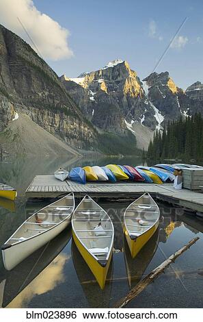 Colorful canoes on dock of Moraine Lake View Large Photo Image Stock Photograph - Colorful canoes on dock of Moraine Lake. Fotosearch