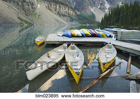 Colorful canoes on dock of Moraine Lake View Large Photo Image Stock Photography - Colorful canoes on dock of Moraine Lake. Fotosearch