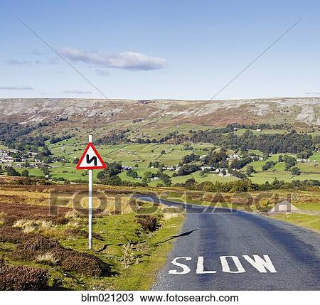 Stock Image - Country Road with Sign. Fotosearch