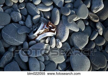 Stock Photography - Crushed Can in Rocks. Fotosearch