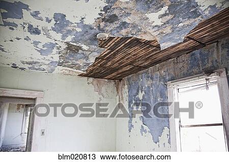 Stock Image - Deteriorating Ceiling in an Abandoned House. Fotosearch