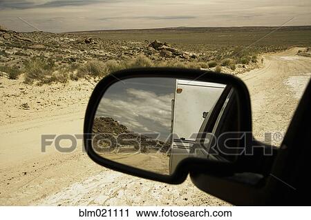 Stock Image - Dirt Road Through Desert. Fotosearch