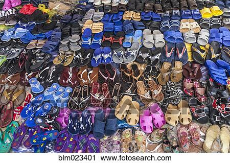 Display of shoes to the market of Ambilobe, in northern Madagascar View Large Photo Image Stock Image - Display of shoes to the market of Ambilobe, in northern Madagascar. Fotosearch