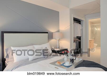 Stock Photo - Double Bed and Night Stands With Lamps. Fotosearch