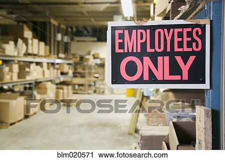 Stock Image - Employee Only Sign in Warehouse. Fotosearch