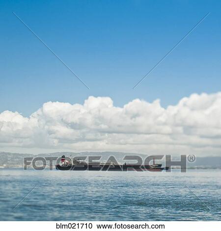Stock Image - Empty Cargo Ship on the Water. Fotosearch