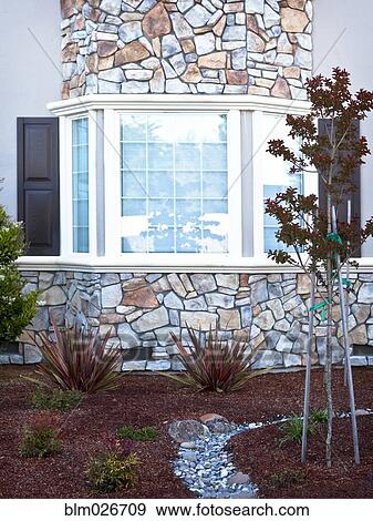 Exterior wall of a house with stone cladding View Large Photo Image Stock Photo - Exterior wall of a house with stone cladding. Fotosearch