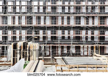 Facade of buildings under construction View Large Photo Image Picture - Facade of buildings under construction. Fotosearch