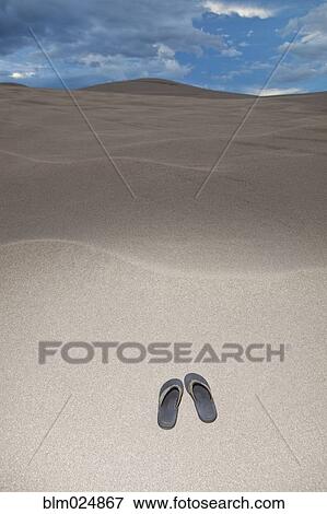 Flip Flops on a Sand Dune View Large Photo Image Stock Photo - Flip Flops on a Sand Dune. Fotosearch