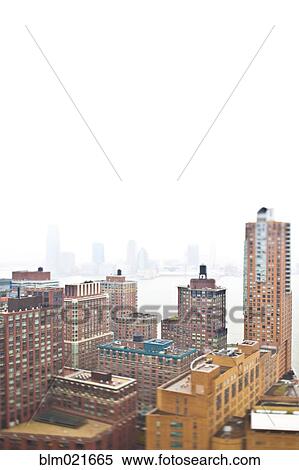 Stock Photography - Foggy Waterfront Cityscape. Fotosearch
