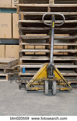 Hand Truck and Wooden Pallets View Large Photo Image Stock Photo - Hand Truck and Wooden Pallets. Fotosearch