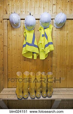 Stock Image - Hard hats and safety vests with reflective stripes. Fotosearch
