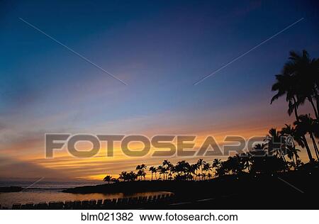 Stock Image - Hawaiian Beach at Sunset. Fotosearch