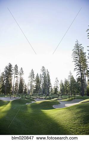 Stock Photo - Hilly Sand Traps on a Golf Course. Fotosearch