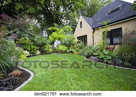 Stock Image - House and Landscaped Yard. Fotosearch