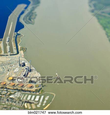 Stock Photo - Industrial Plant on a Waterfront. Fotosearch