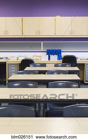 Stock Image - Interior of a classroom in a modern secondary school with desks. Fotosearch