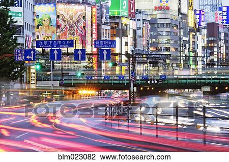 Stock Image - Japanese Downtown Traffic At Dusk. Fotosearch