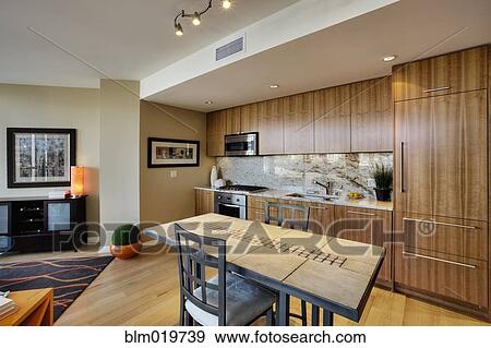 Stock Photo - Kitchen and Dining Area in Upscale Condo. Fotosearch