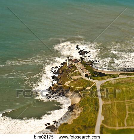 Lighthouse on a Rocky Coast View Large Photo Image Stock Image - Lighthouse on a Rocky Coast. Fotosearch