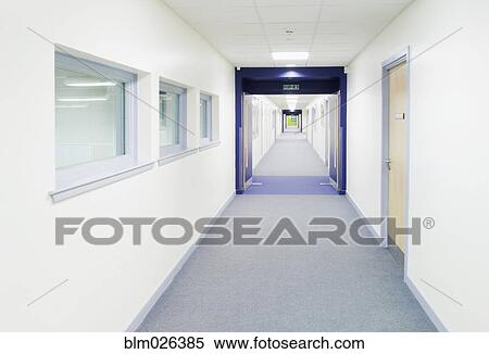 Looking along a modern white corridor of a secondary school View Large Photo Image Stock Photography - Looking along a modern white corridor of a secondary school. Fotosearch