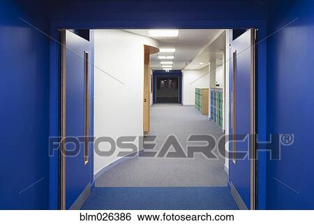 Looking through fire doors and along a corridor or a modern secondary school View Large Photo Image Stock Photograph - Looking through fire doors and along a corridor or a modern secondary school. Fotosearch