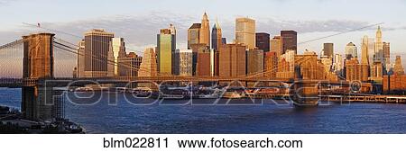 Stock Image - Lower Manhattan and the Brooklyn Bridge. Fotosearch