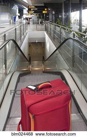 Luggage at the Top of an Escalator View Large Photo Image Stock Photo - Luggage at the Top of an Escalator. Fotosearch