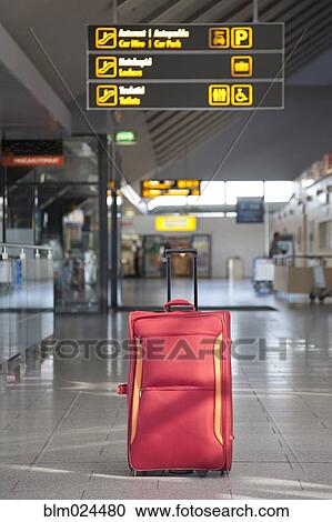 Stock Image - Luggage Sitting Alone in an Airport Terminal. Fotosearch
