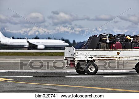 Luggage Trailer on the Airport Tarmac View Large Photo Image Stock Image - Luggage Trailer on the Airport Tarmac. Fotosearch