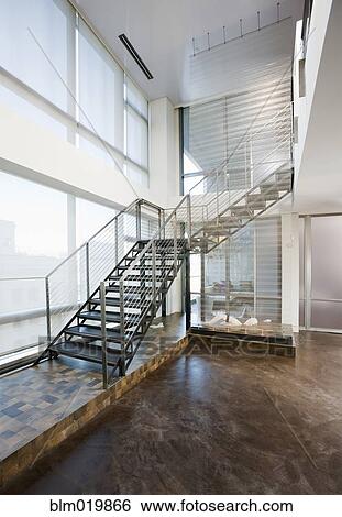 Stock Photograph - Metal Stairs Leading to Second Floor. Fotosearch
