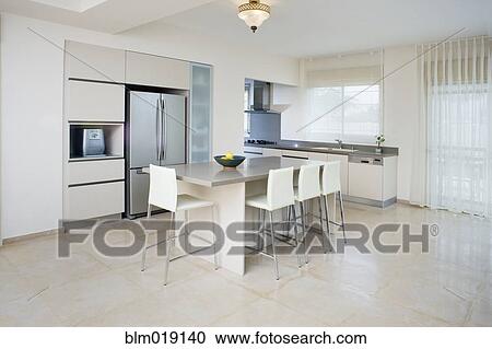 Stock Image - Modern Kitchen and Dining Table. Fotosearch