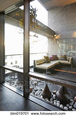 Stock Image - Modern Sofa and Sculptures. Fotosearch