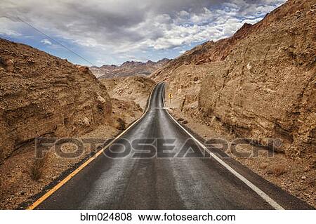 Narrow road through Death Valley View Large Photo Image Stock Photo - Narrow road through Death Valley. Fotosearch