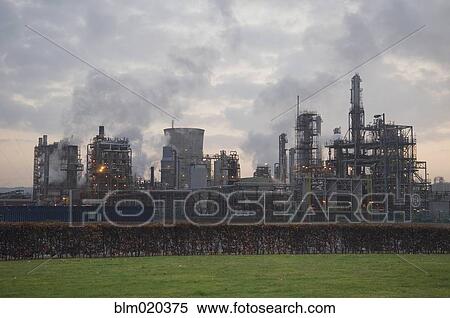 Oil refinery buildings and processing plant at dusk View Large Photo Image Stock Photography - Oil refinery buildings and processing plant at dusk. Fotosearch