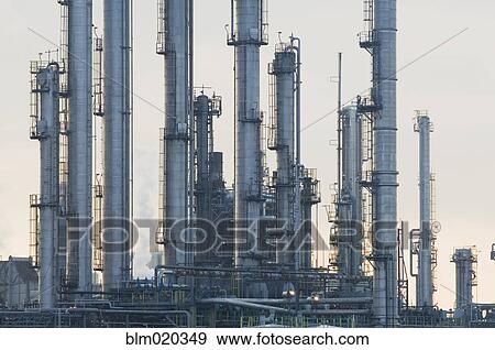 Oil refinery buildings View Large Photo Image Stock Photo - Oil refinery buildings. Fotosearch