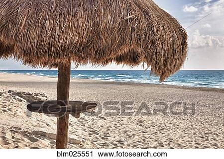 Palapa thatch sun umbrella on the beach at Cancun View Large Photo Image Stock Image - Palapa thatch sun umbrella on the beach at Cancun. Fotosearch