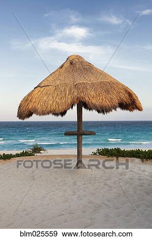 Palapa thatched shade on the beach View Large Photo Image Stock Photo - Palapa thatched shade on the beach. Fotosearch