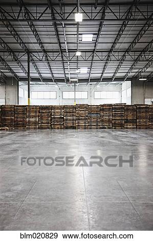 Pallets in an Empty Warehouse View Large Photo Image Stock Photo - Pallets in an Empty Warehouse. Fotosearch