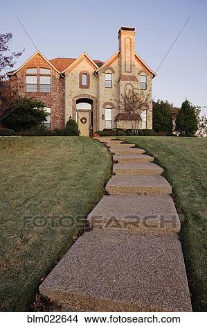 Picture - Pathway to Large Home on Hillside. Fotosearch