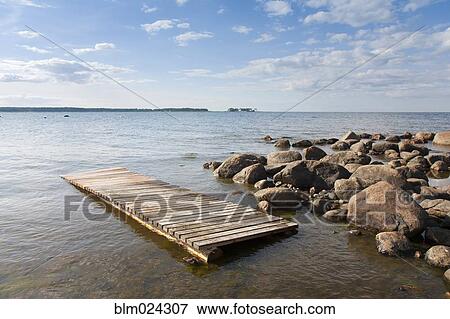 Pier Floating on a Rocky Shore View Large Photo Image Stock Photo - Pier Floating on a Rocky Shore. Fotosearch