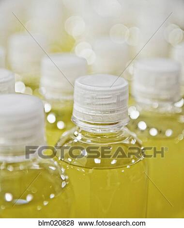 Plastic Bottles Filled with a Yellow Liquid View Large Photo Image Stock Photo - Plastic Bottles Filled with a Yellow Liquid. Fotosearch