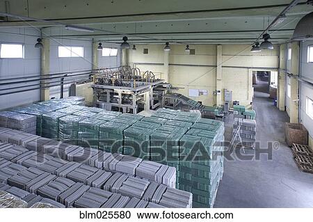 Stock Image - Processing plant of cardboard cartons for packaging eggs. Fotosearch