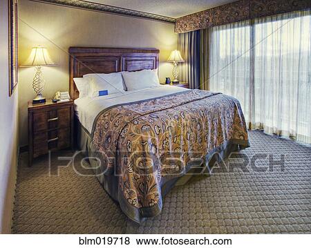 Stock Photo - Queen Bedroom Set in Hotel Room. Fotosearch
